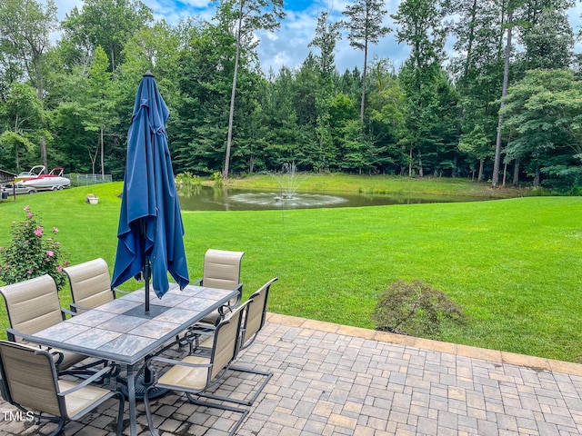 125 Al Gray Rd, Timberlake, NC 27583 - view of patio / terrace with outdoor dining area and a water view