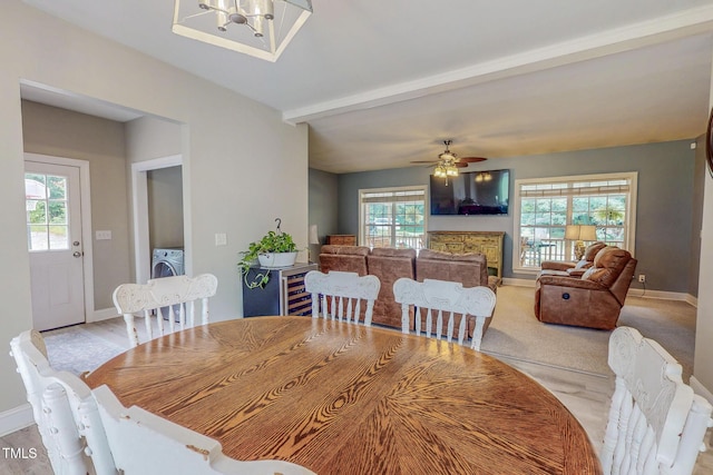 125 Al Gray Rd, Timberlake, NC 27583 - dining room with plenty of natural light, washer / dryer, ceiling fan, beam ceiling, and beverage cooler