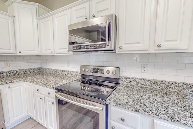 125 Al Gray Rd, Timberlake, NC 27583 - kitchen featuring appliances with stainless steel finishes and white cabinets
