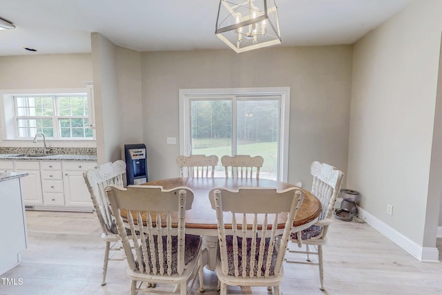 125 Al Gray Rd, Timberlake, NC 27583 - dining room with light wood-type flooring and a chandelier