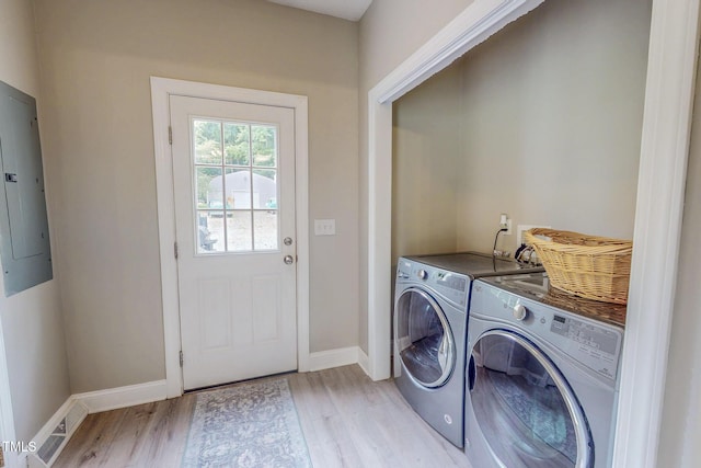 125 Al Gray Rd, Timberlake, NC 27583 - washroom featuring washer and clothes dryer, light wood-type flooring, and electric panel