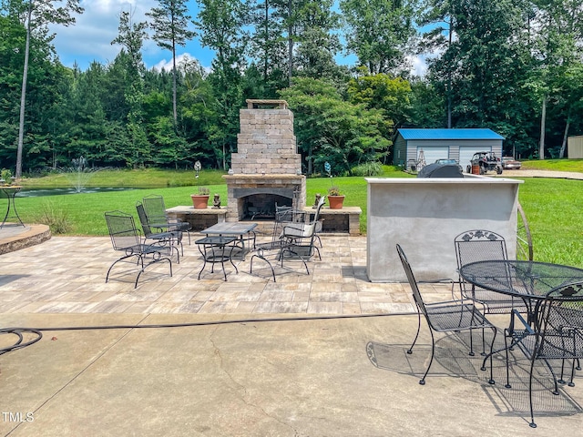 125 Al Gray Rd, Timberlake, NC 27583 - view of patio / terrace with exterior fireplace, outdoor dining space, an outdoor structure, and view of scattered trees