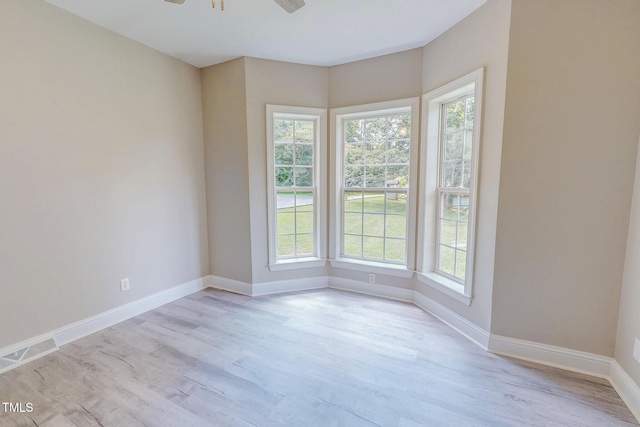 125 Al Gray Rd, Timberlake, NC 27583 - empty room featuring plenty of natural light, light wood-type flooring, and ceiling fan