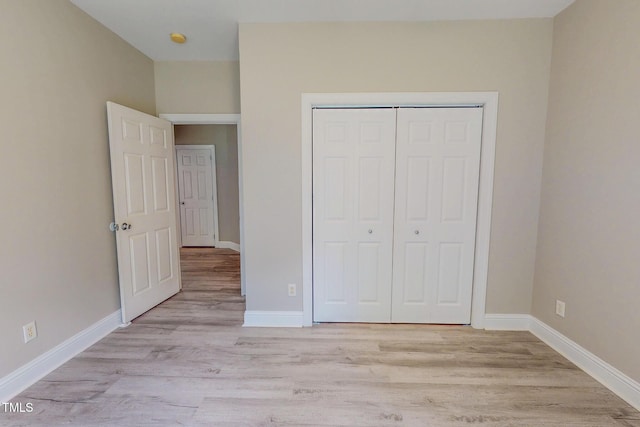 125 Al Gray Rd, Timberlake, NC 27583 - unfurnished bedroom featuring light wood-type flooring and a closet