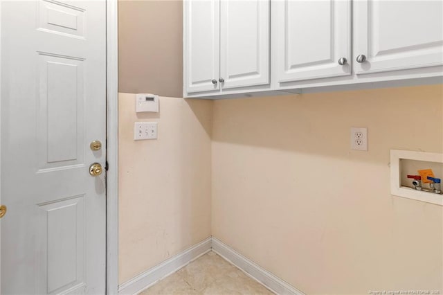 8017 Trout Creek Rd, Fayetteville, NC 28304 - laundry room with cabinet space, washer hookup, and light tile patterned flooring