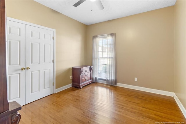 8017 Trout Creek Rd, Fayetteville, NC 28304 - unfurnished bedroom with light wood-style flooring, a closet, and a ceiling fan