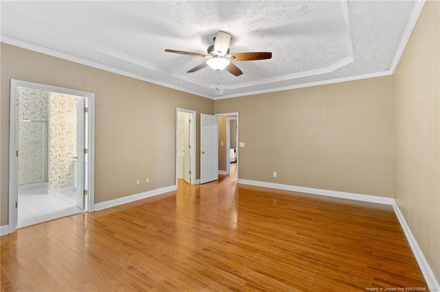 8017 Trout Creek Rd, Fayetteville, NC 28304 - unfurnished bedroom featuring light wood-style flooring, ensuite bathroom, ceiling fan, a textured ceiling, and ornamental molding