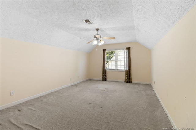 8017 Trout Creek Rd, Fayetteville, NC 28304 - bonus room featuring vaulted ceiling, a textured ceiling, light colored carpet, and a ceiling fan