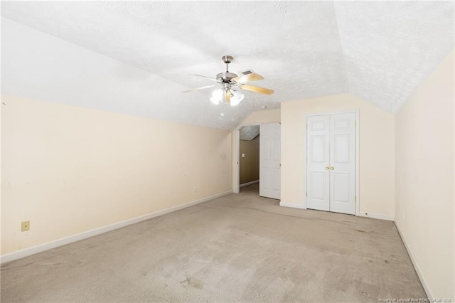 8017 Trout Creek Rd, Fayetteville, NC 28304 - additional living space featuring carpet, lofted ceiling, a ceiling fan, and a textured ceiling