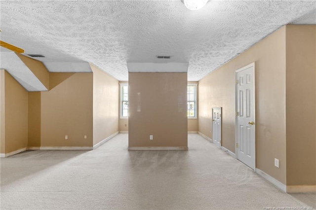 8017 Trout Creek Rd, Fayetteville, NC 28304 - carpeted empty room featuring baseboards and a textured ceiling