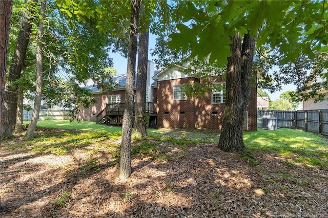 8017 Trout Creek Rd, Fayetteville, NC 28304 - fenced backyard with a deck and stairs