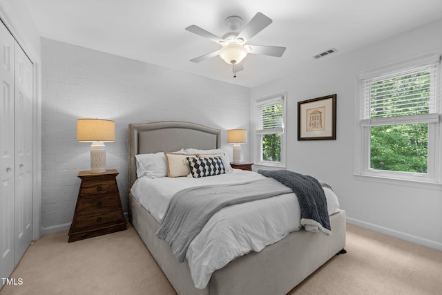 103 Wyseferry Ct, Morrisville, NC 27560 - bedroom with light colored carpet, ceiling fan, and a closet