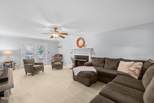 103 Wyseferry Ct, Morrisville, NC 27560 - living area featuring light carpet, a ceiling fan, ornamental molding, a fireplace with flush hearth, and french doors
