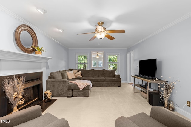 103 Wyseferry Ct, Morrisville, NC 27560 - carpeted living room with a ceiling fan, ornamental molding, and a fireplace with flush hearth