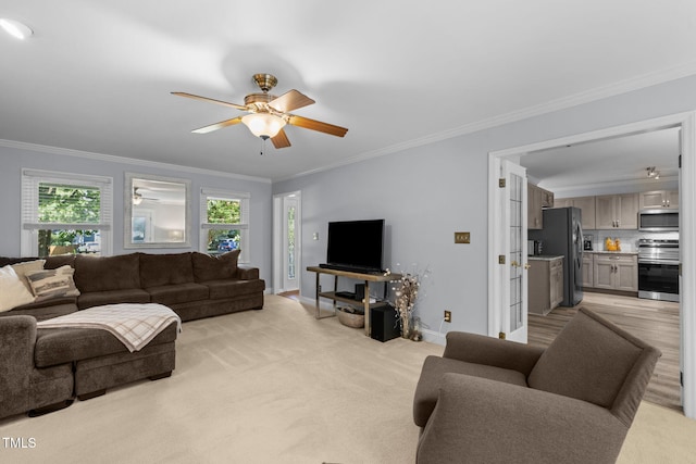 103 Wyseferry Ct, Morrisville, NC 27560 - living room featuring ceiling fan, plenty of natural light, ornamental molding, and light colored carpet