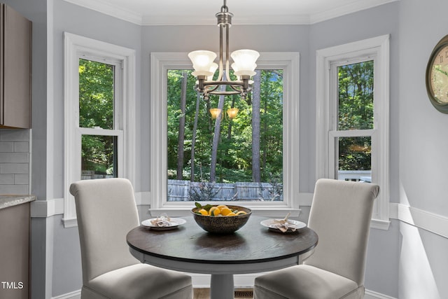 103 Wyseferry Ct, Morrisville, NC 27560 - dining area featuring a chandelier, healthy amount of natural light, and crown molding