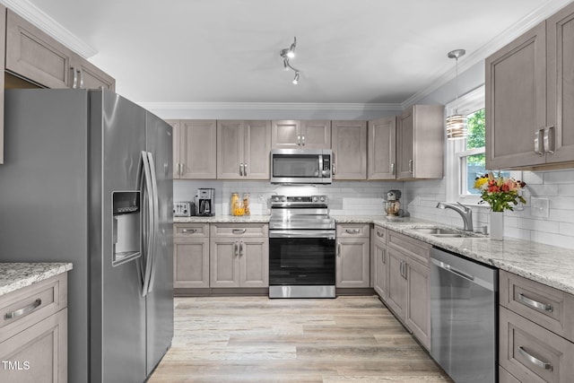 103 Wyseferry Ct, Morrisville, NC 27560 - kitchen with appliances with stainless steel finishes, light wood-style floors, tasteful backsplash, crown molding, and light stone countertops