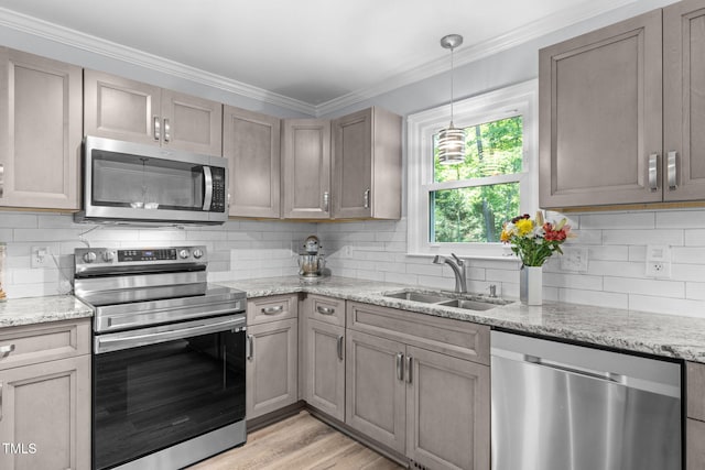 103 Wyseferry Ct, Morrisville, NC 27560 - kitchen with stainless steel appliances, decorative backsplash, light stone counters, and crown molding
