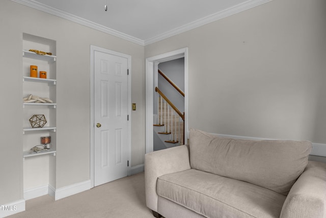 103 Wyseferry Ct, Morrisville, NC 27560 - sitting room featuring light colored carpet, crown molding, stairs, and built in shelves