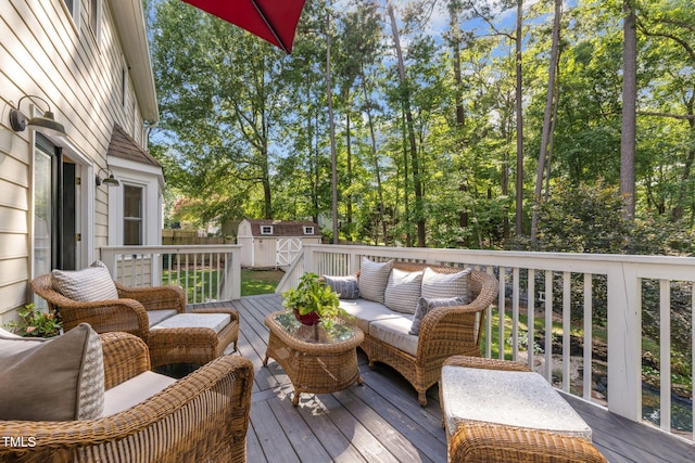 103 Wyseferry Ct, Morrisville, NC 27560 - wooden deck featuring an outdoor living space, a storage unit, and view of scattered trees