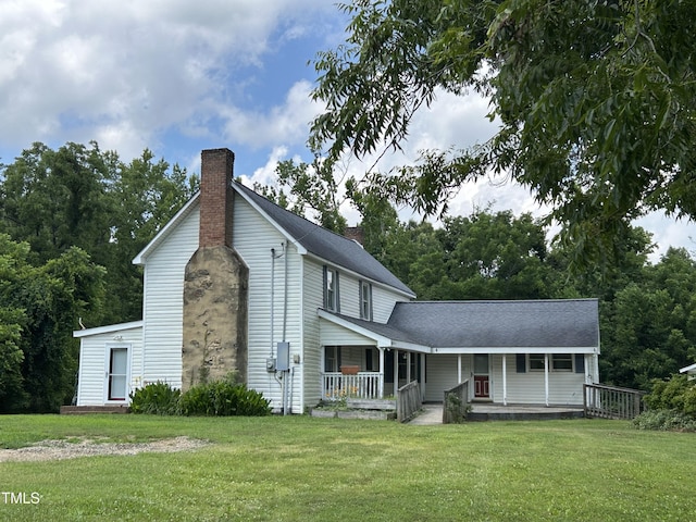 243 Victor Chandler Rd, Timberlake, NC 27583 - view of front of property featuring a chimney, covered porch, and a front yard