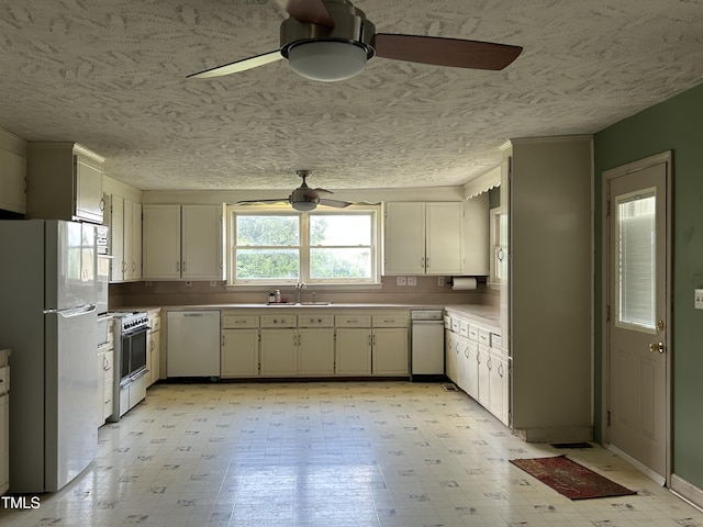 243 Victor Chandler Rd, Timberlake, NC 27583 - kitchen with a ceiling fan, white appliances, a textured ceiling, and light floors