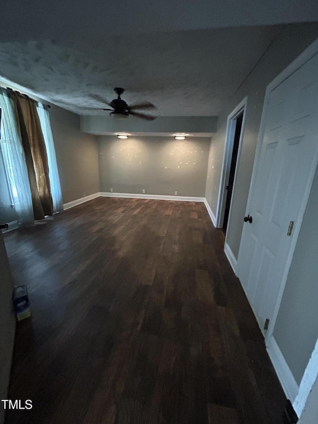 243 Victor Chandler Rd, Timberlake, NC 27583 - empty room with a ceiling fan and dark wood-type flooring