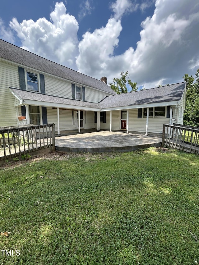 243 Victor Chandler Rd, Timberlake, NC 27583 - rear view of house with a chimney and a patio area