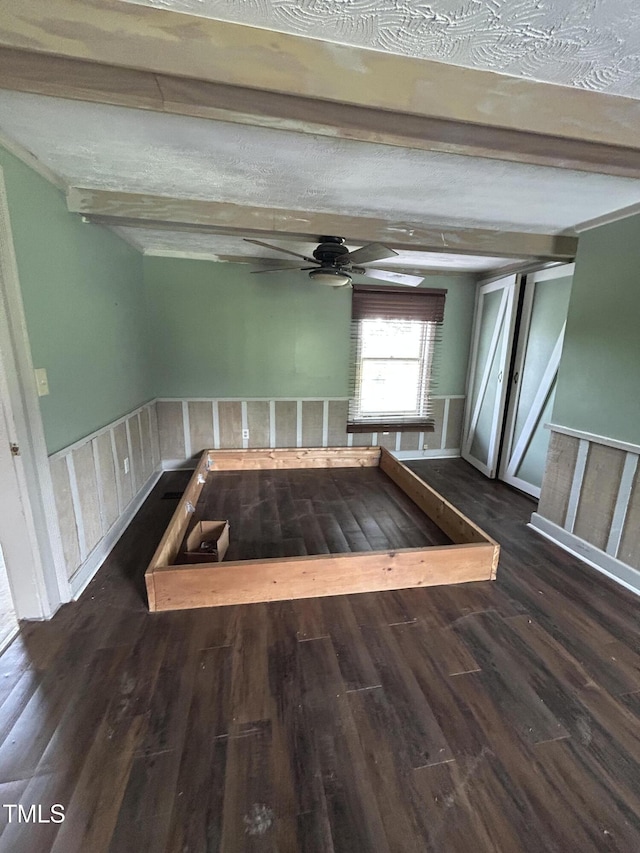 243 Victor Chandler Rd, Timberlake, NC 27583 - unfurnished room with wood finished floors, beam ceiling, and a ceiling fan