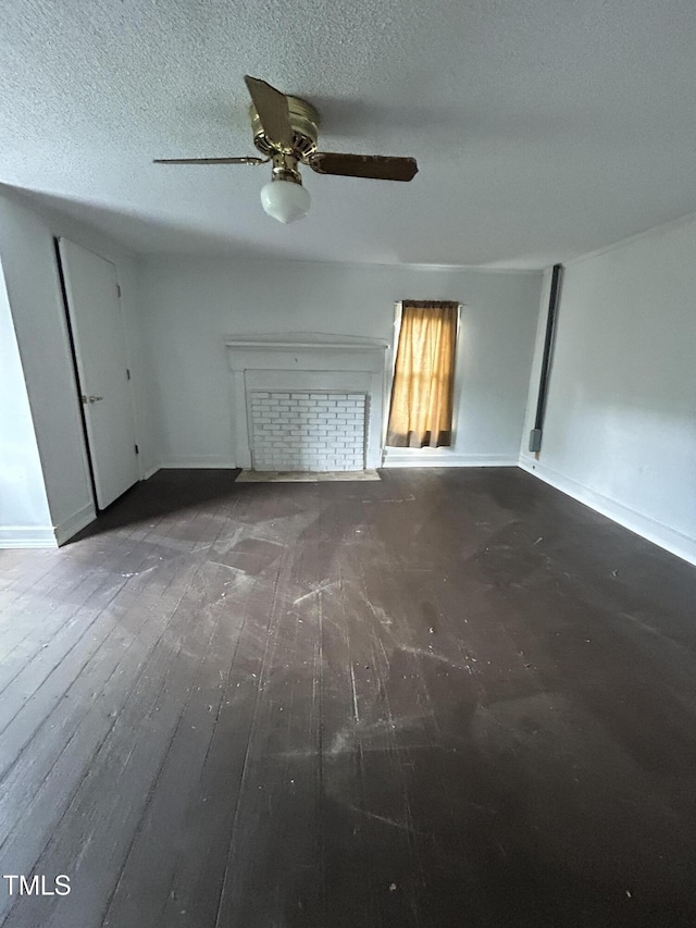 243 Victor Chandler Rd, Timberlake, NC 27583 - unfurnished living room with hardwood / wood-style flooring, a ceiling fan, and a textured ceiling