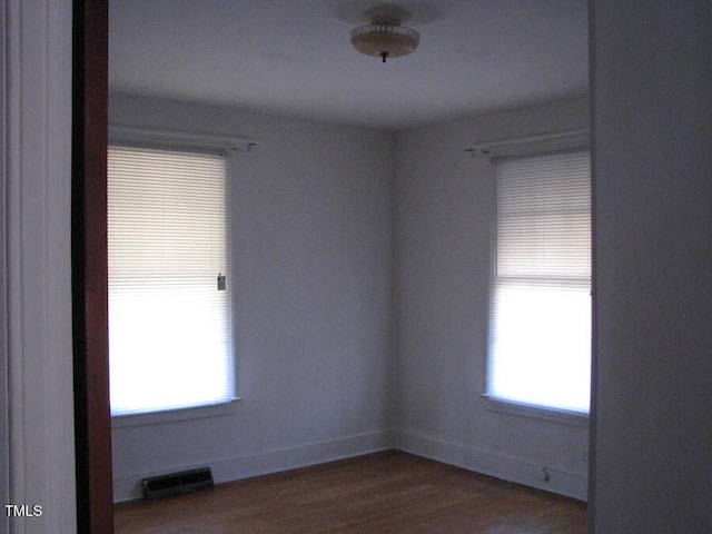 2206 E Club Blvd, Durham, NC 27704 - spare room featuring wood finished floors and baseboards