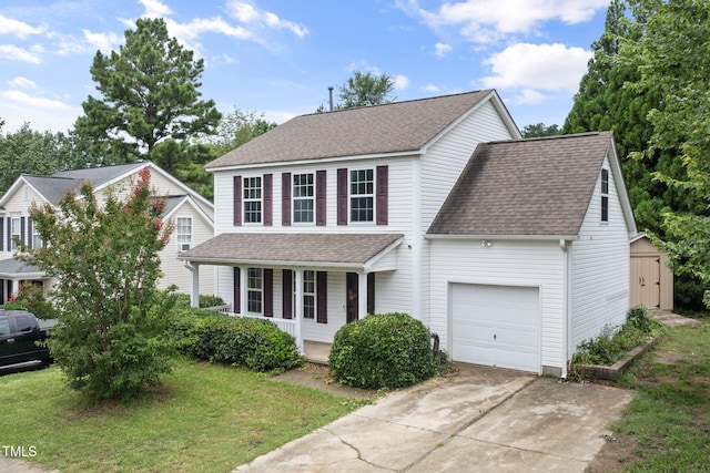 5528 Wilhagan Ct, Raleigh, NC 27616 - traditional home with covered porch, roof with shingles, an attached garage, and driveway