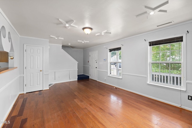 5528 Wilhagan Ct, Raleigh, NC 27616 - empty room with hardwood / wood-style floors, healthy amount of natural light, and crown molding