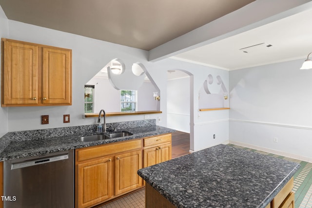 5528 Wilhagan Ct, Raleigh, NC 27616 - kitchen featuring dishwasher, dark stone countertops, brown cabinetry, a kitchen island, and ornamental molding