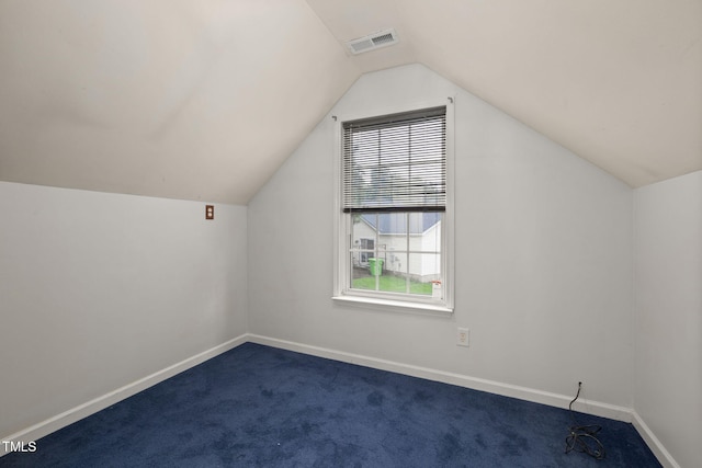 5528 Wilhagan Ct, Raleigh, NC 27616 - additional living space featuring dark colored carpet and vaulted ceiling