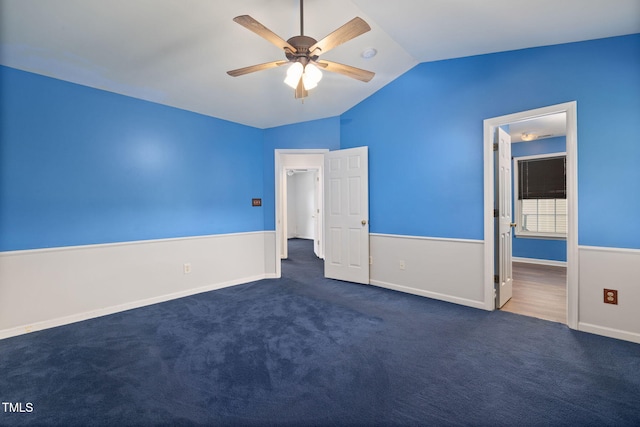 5528 Wilhagan Ct, Raleigh, NC 27616 - unfurnished bedroom featuring vaulted ceiling, dark colored carpet, ceiling fan, and ensuite bath