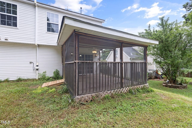 5528 Wilhagan Ct, Raleigh, NC 27616 - back of property with a sunroom and a lawn