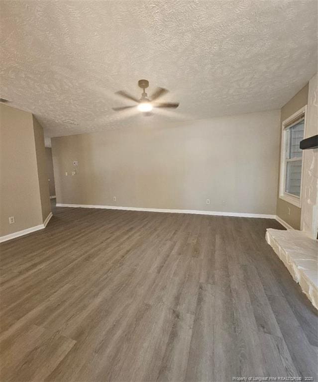 6771 Willowbrook Dr Unit 6, Fayetteville, NC 28314 - empty room with a ceiling fan, a textured ceiling, and dark wood-style floors
