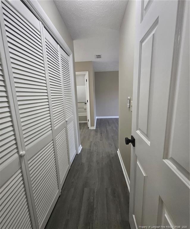 6771 Willowbrook Dr Unit 6, Fayetteville, NC 28314 - hall featuring dark wood finished floors and a textured ceiling