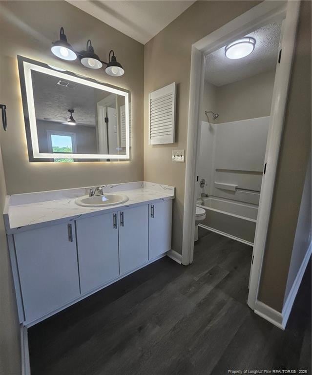 6771 Willowbrook Dr Unit 6, Fayetteville, NC 28314 - bathroom with vanity, wood finished floors, and shower / washtub combination