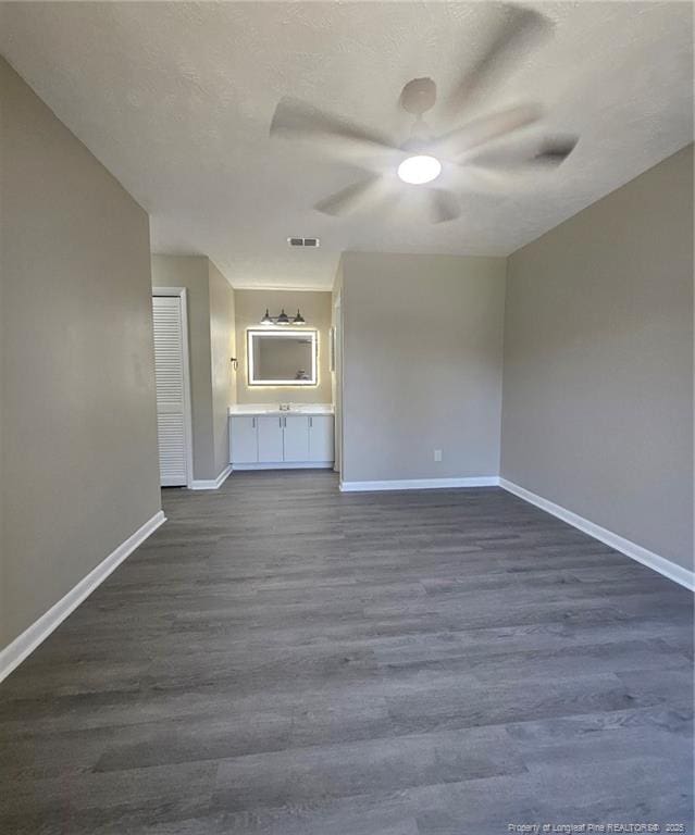 6771 Willowbrook Dr Unit 6, Fayetteville, NC 28314 - unfurnished living room featuring a ceiling fan and dark wood-type flooring