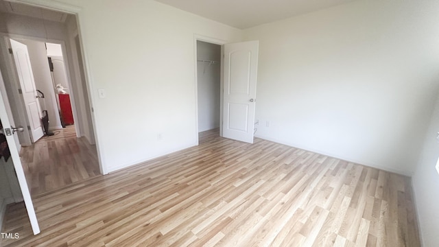 1008 Gold Cir, Mebane, NC 27302 - unfurnished bedroom with light wood-type flooring and a closet