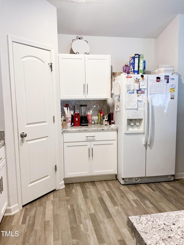 1008 Gold Cir, Mebane, NC 27302 - kitchen with white refrigerator with ice dispenser, light wood finished floors, and white cabinets