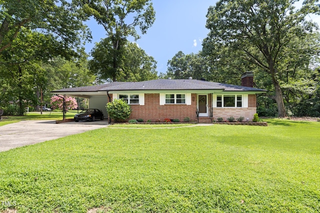 2603 Fairlawn Rd, Durham, NC 27705 - single story home featuring driveway, brick siding, a chimney, a carport, and a front lawn