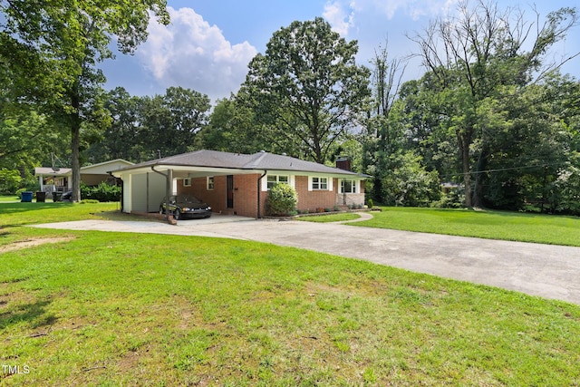 2603 Fairlawn Rd, Durham, NC 27705 - ranch-style house with concrete driveway, a front yard, brick siding, a chimney, and an attached carport