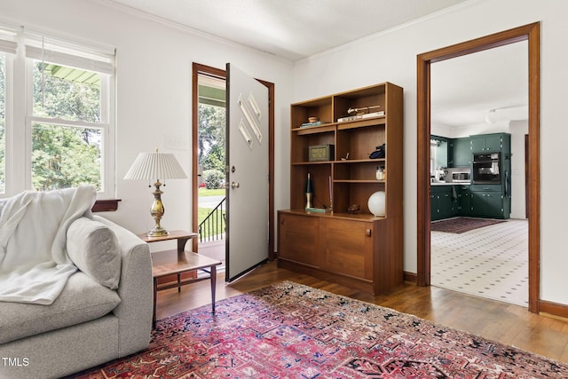 2603 Fairlawn Rd, Durham, NC 27705 - living area with plenty of natural light, wood finished floors, and ornamental molding