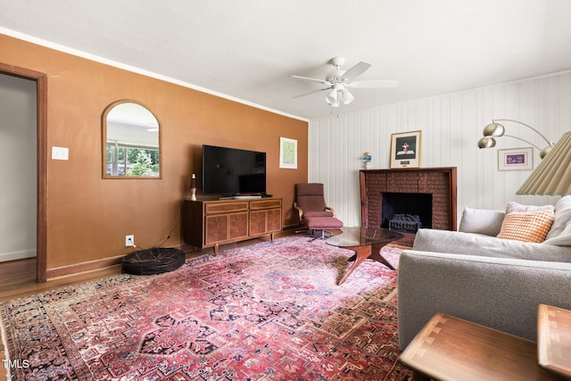 2603 Fairlawn Rd, Durham, NC 27705 - living room featuring ceiling fan, crown molding, wood finished floors, and a fireplace