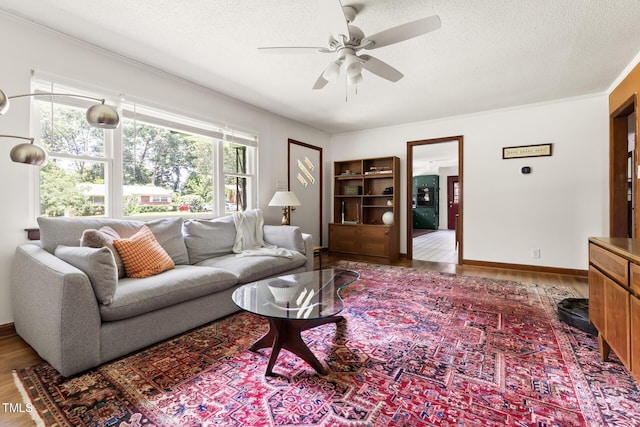2603 Fairlawn Rd, Durham, NC 27705 - living area with wood finished floors, ceiling fan, and a textured ceiling