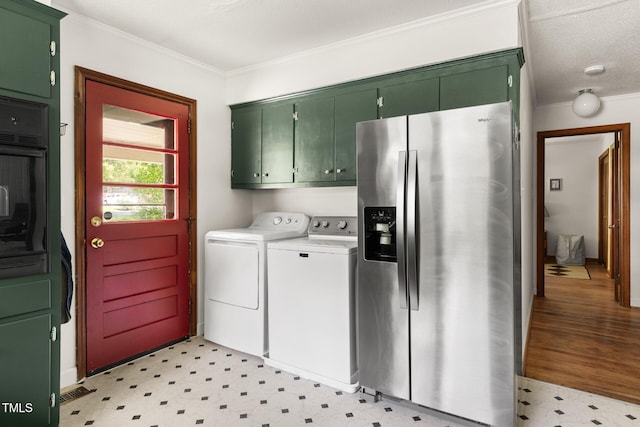 2603 Fairlawn Rd, Durham, NC 27705 - laundry room featuring crown molding, light flooring, and washing machine and clothes dryer