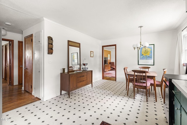 2603 Fairlawn Rd, Durham, NC 27705 - dining area featuring a chandelier and crown molding